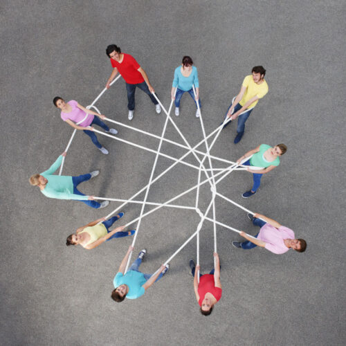 People playing with tangled string